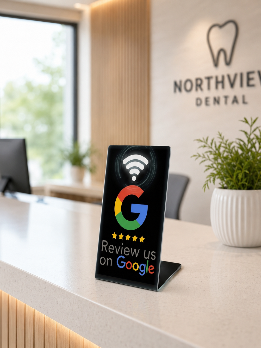 TapZilla NFC review stand displayed on a dental clinic reception counter